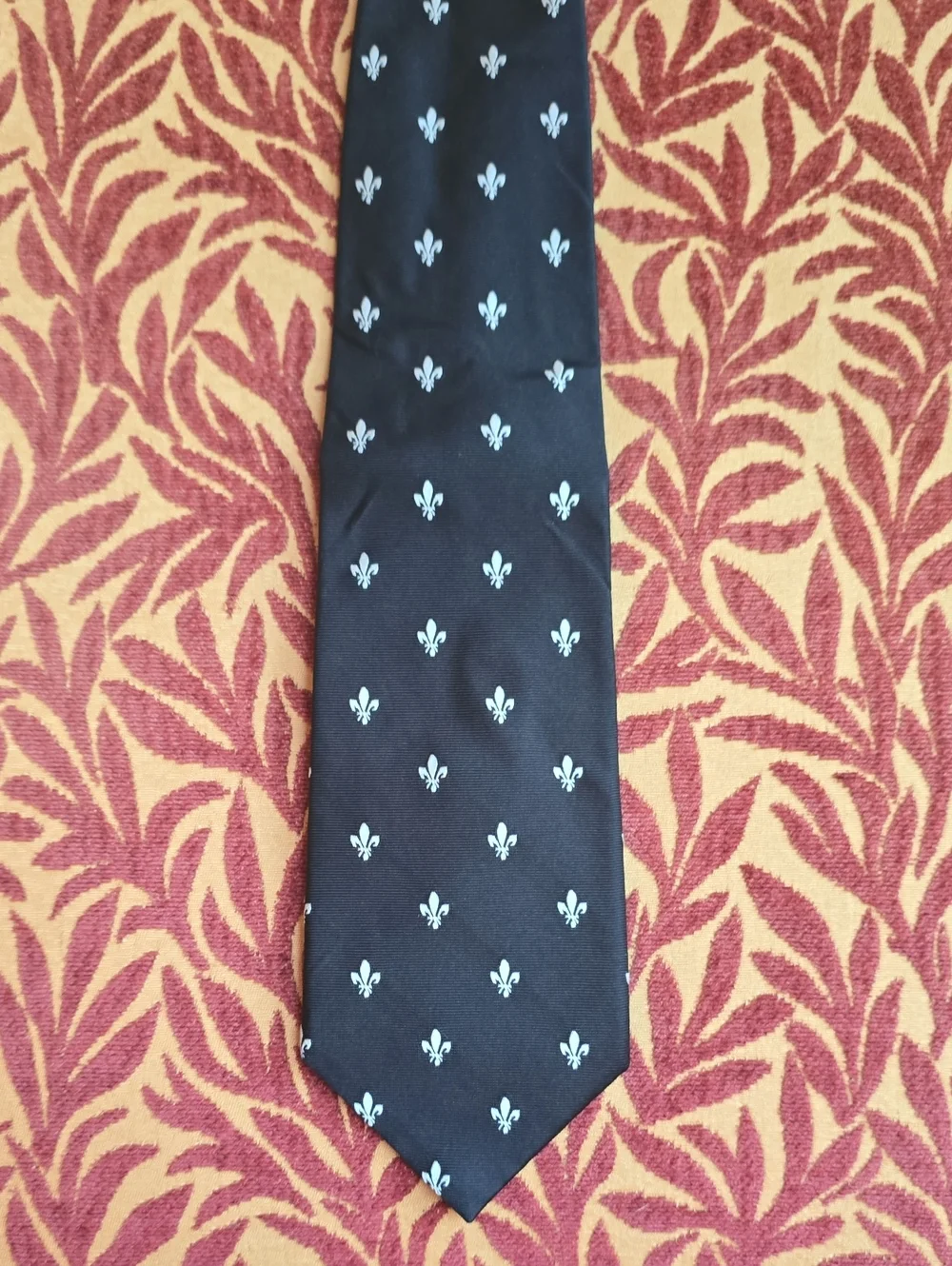 Classic Black Men's Tie with White Fleur-de-Lis Pattern